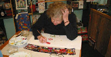 Barbara Tack demonstrating painting with watercolors.